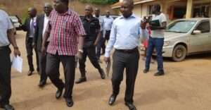 Accused; The then Mayor Lira City Mike Ogwang Veve(Checked) shirt and Deputy Town clerk, Patrick Ogweng (Light blue) shirt dragged by the State House anti-corruption over abuse of office in 2019